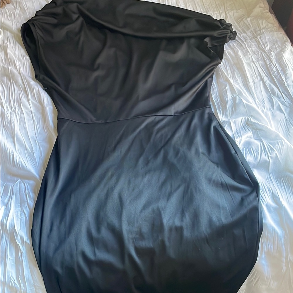 Formal dress form fitting with asymmetrical collar.